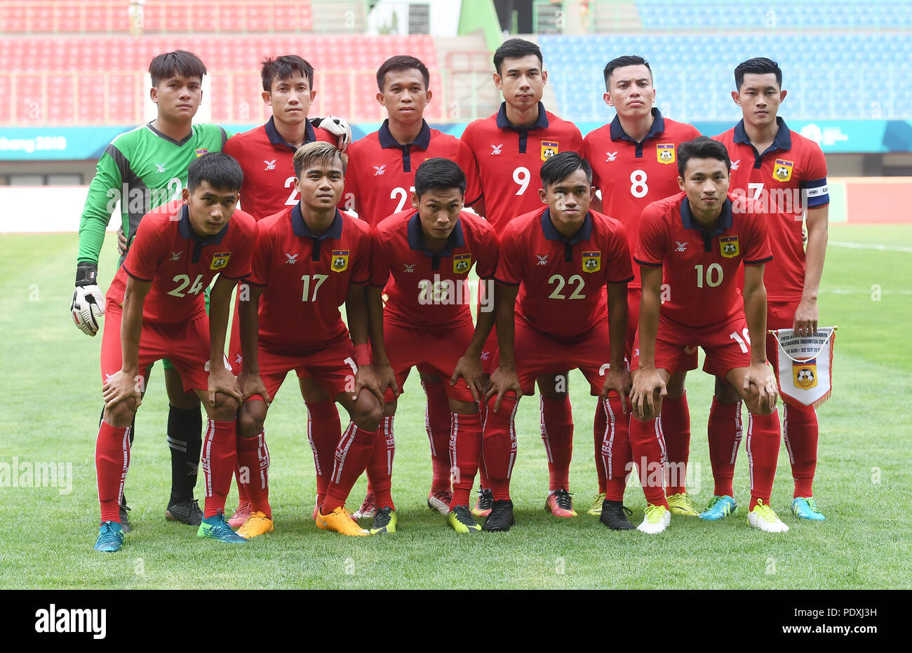 Bekasi, Indonesia. 10th Aug, 2018. Players of Laos pose for a team photo before the Men's Football Group A match between Hong Kong of China and Laos at the 18th Asian Games at Patriot Stadium in Bekasi, Indonesia, Aug. 10, 2018. Credit: Jia Yuchen/Xinhua/Alamy Live News Stock Photo