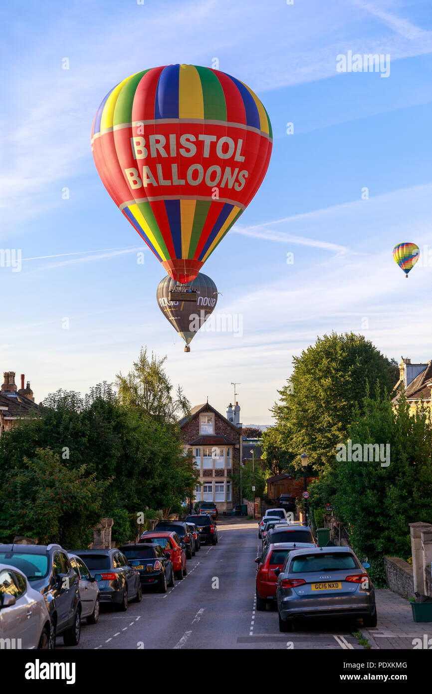 Bristol, UK, 11th August, 2018. Balloons flying low over Clifton after Mass Ascent from Bristol Balloon Fiesta 2018. Credit: Will Dale/Alamy Live News. Stock Photo