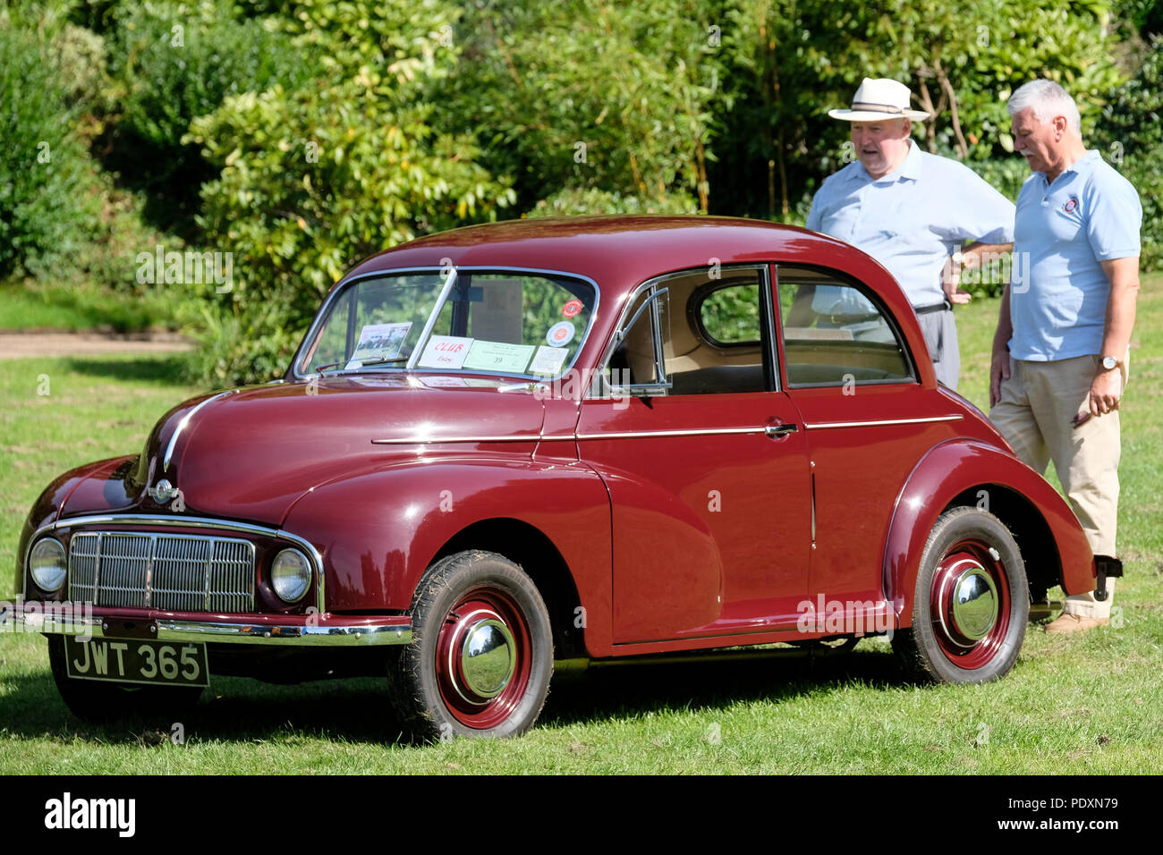 Two classic car enthusiasts admire a Classic Morris Minor Stock Photo Alamy