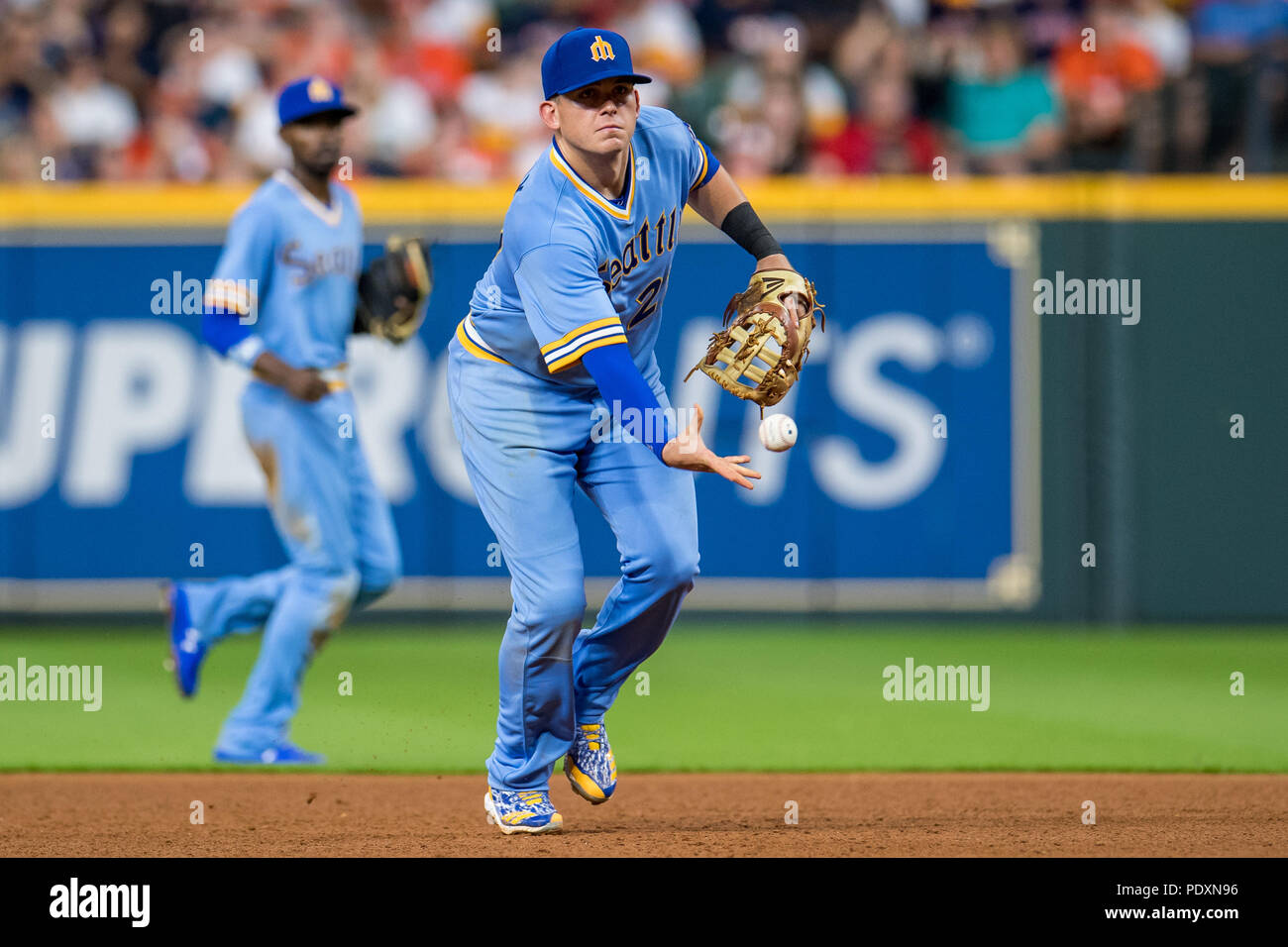 August 10, 2018: Seattle Mariners first baseman Ryon Healy (27) tosses the ball toward first to record an during a Major Baseball game between Houston Astros and the Seattle