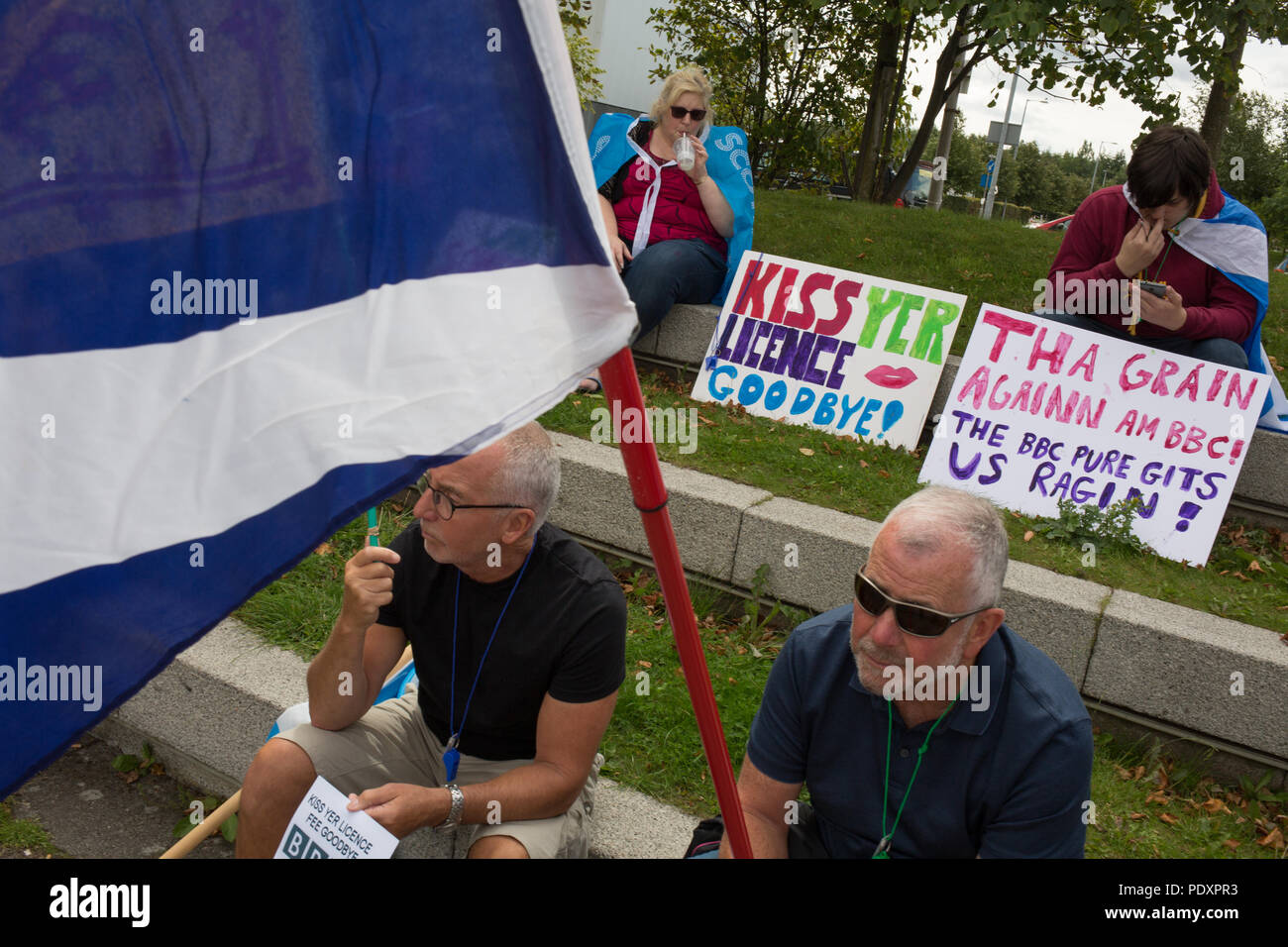 Glasgow, Scotland, on 11 August 2018. Pro-Scottish independence supporters protest against a perceived bias of the BBC against Scotland and the pro-Scottish indpendence movement. Approximately 300 people took part in the protest outside the BBC at Pacific Quay, in Glasgow, Scotland. Image credit: Jeremy Sutton-Hibbert/ Alamy News. Stock Photo