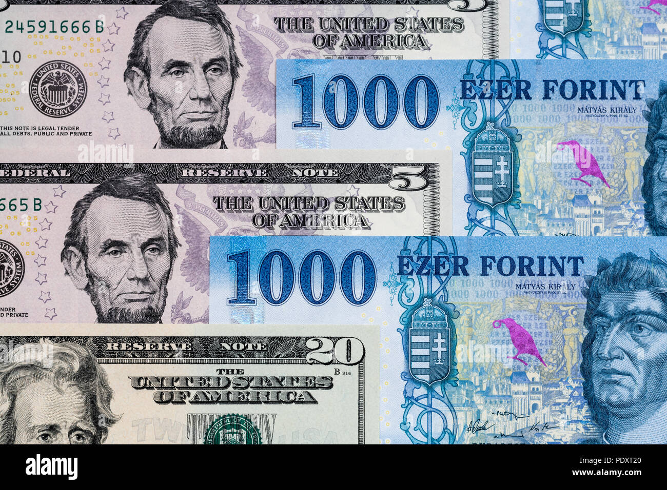 US dollar and new Hungarian forint banknotes mixed. Forint US dollar exchange rate Stock Photo