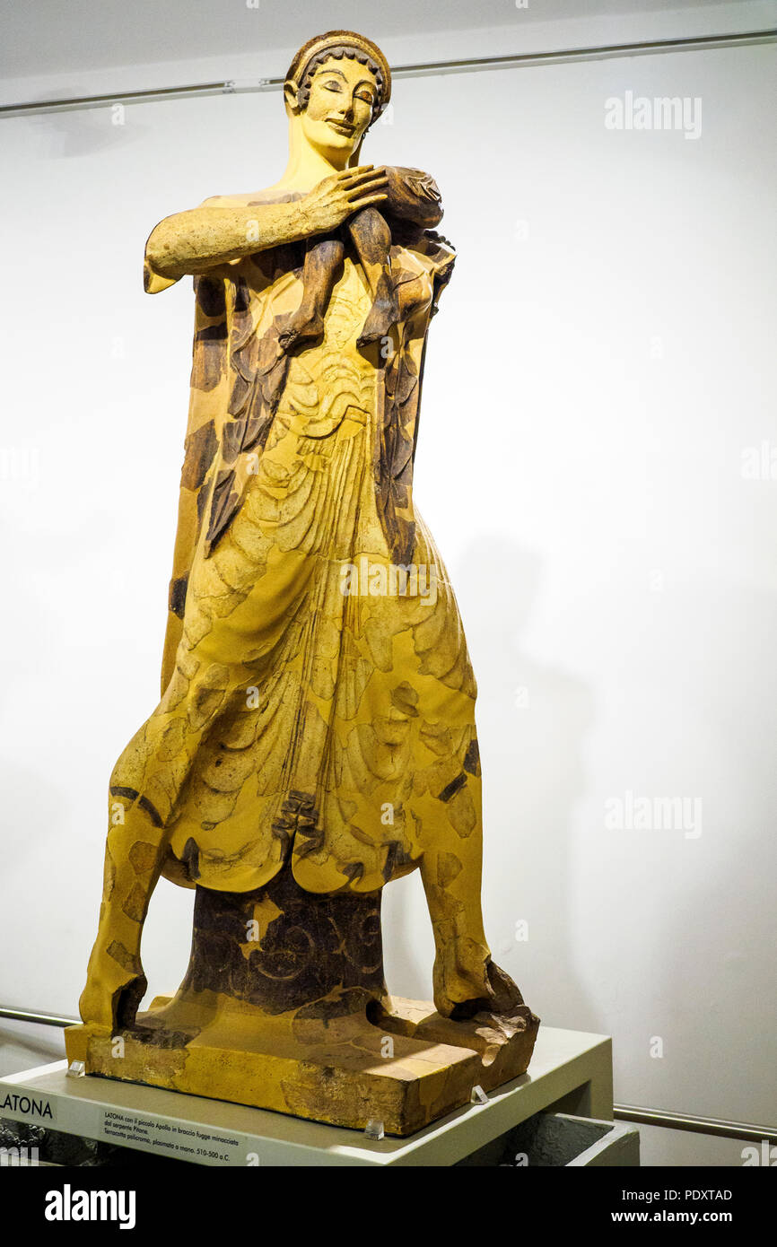 Statue of Latona with the little Apollo in her arms flees threatened by the snake. Polychrome terracotta, hand-molded from Veio 510 to 500 BC - National Etruscan Museum of Villa Giulia - Rome, Italy Stock Photo
