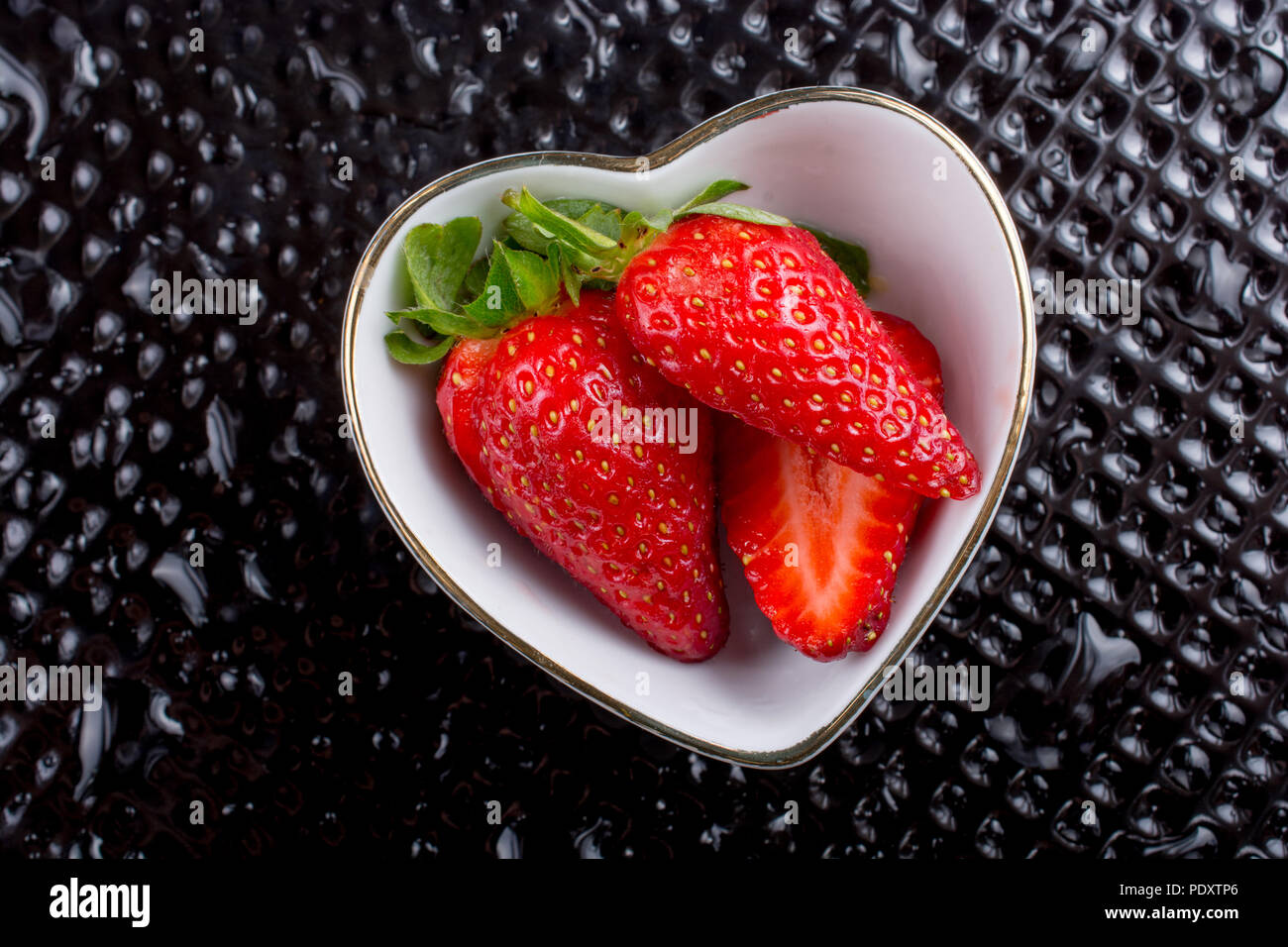 Juicy, sweet and ripe strawberry fruit in a bowl Stock Photo - Alamy
