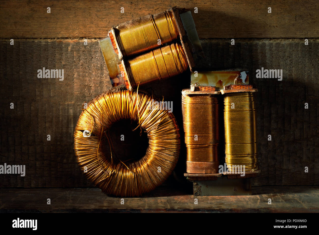Three old copper wire coils Stock Photo Alamy