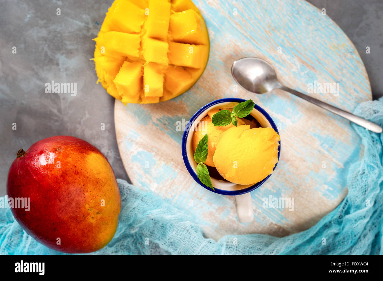 Top view of mango sorbet in cup with mango fruit Stock Photo - Alamy