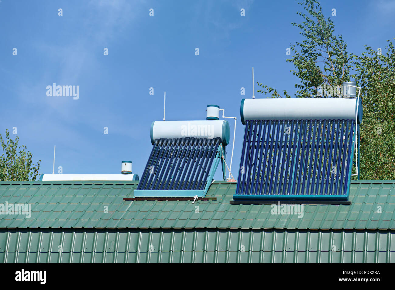 Solar water heater for home. Renewable environmental energy. Stock Photo