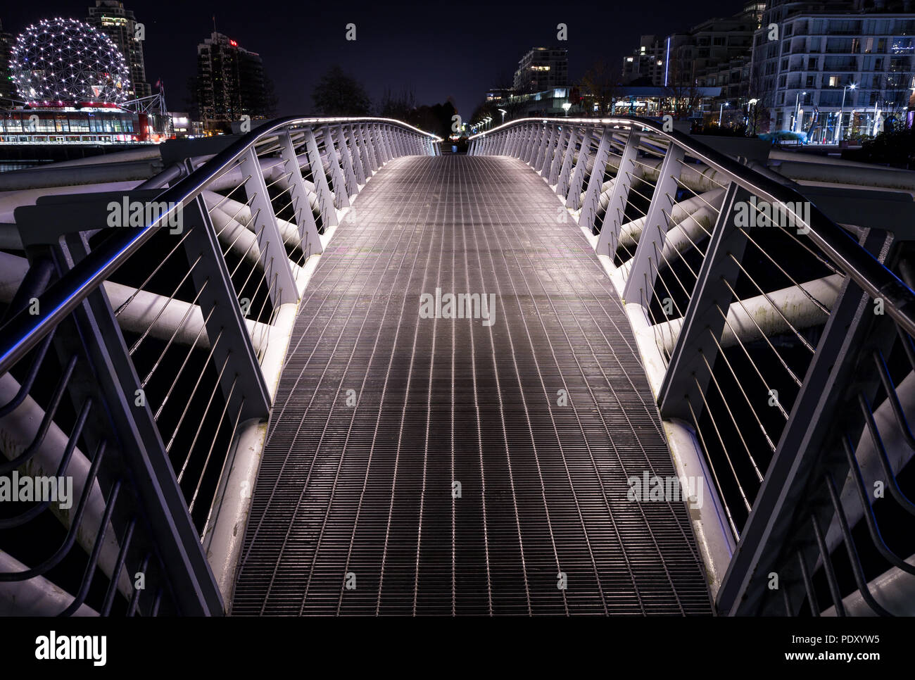 Small pedestrian bridge at night in False Creek, Vancouver Stock Photo ...