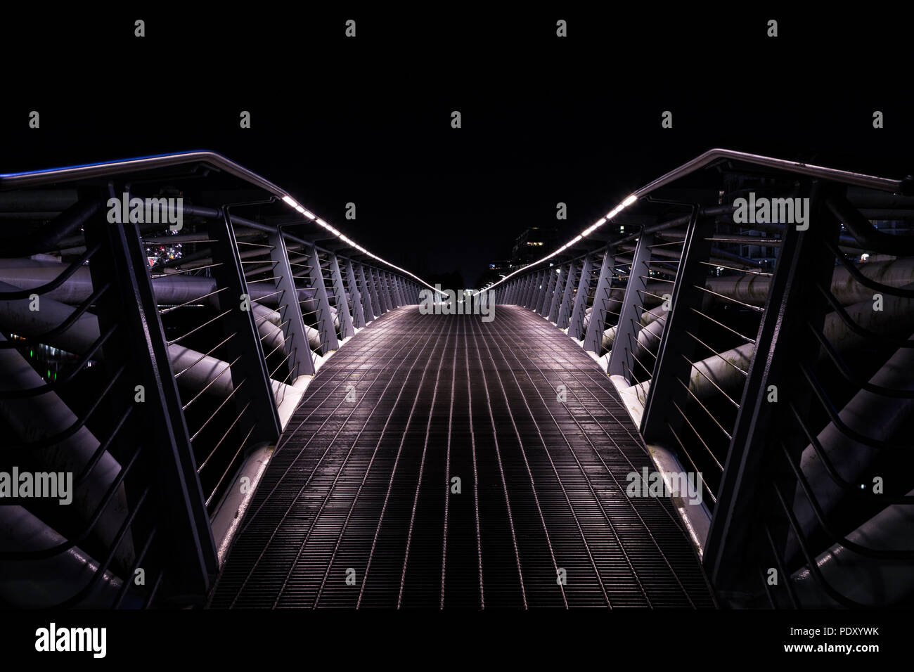 Small pedestrian bridge at night in False Creek, Vancouver Stock Photo ...