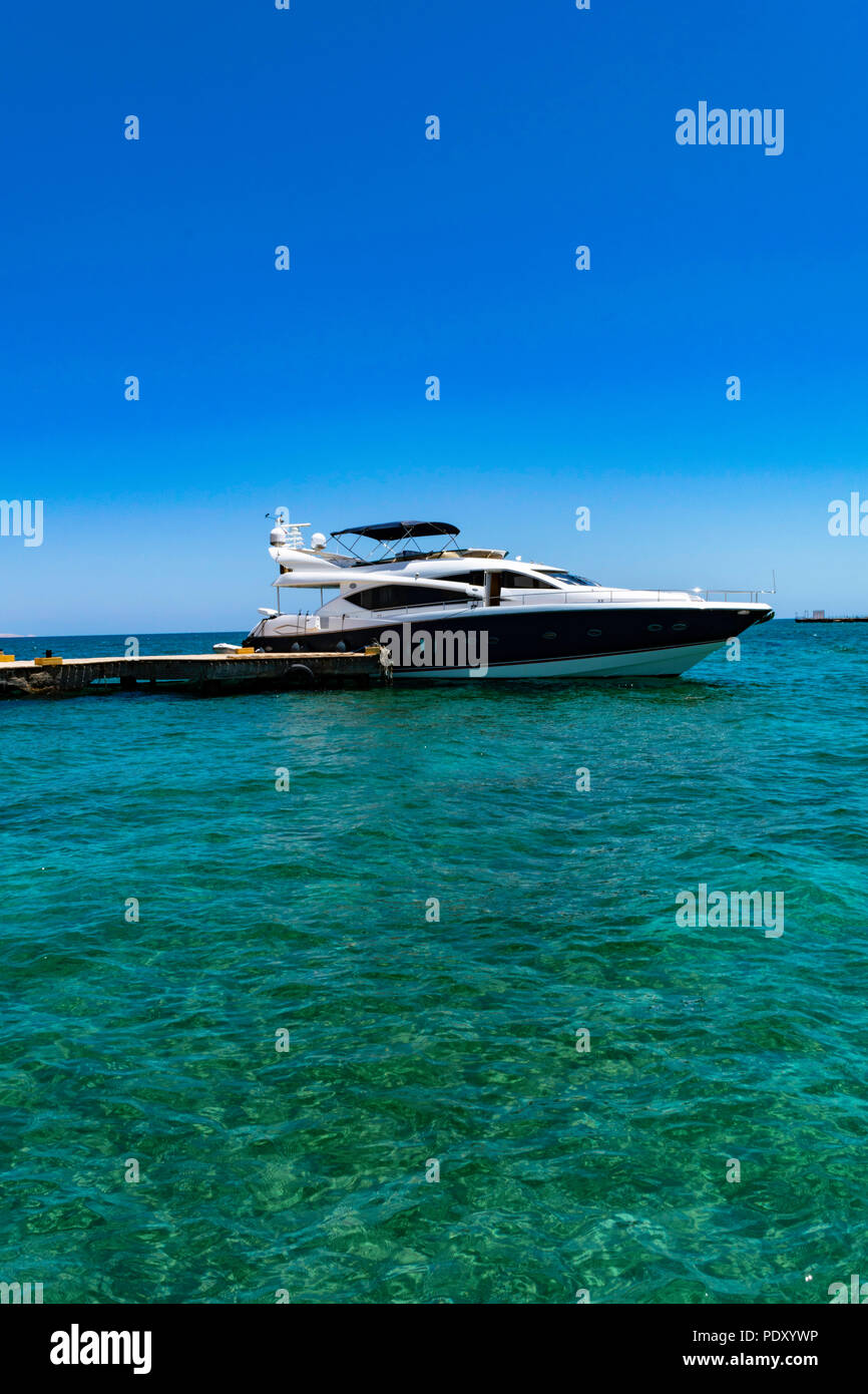 White yacht drifting in the waters of the red Sea with view to wooden ...