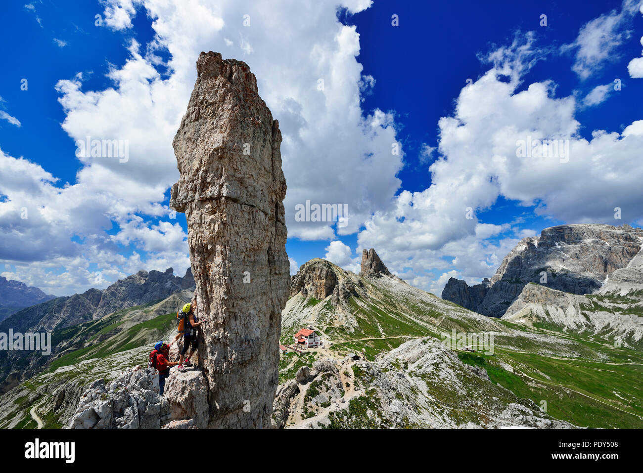 Climbers at the rock needle Frankfurter Sausage, Salsiccia, Sexten Dolomites, Alta Pusteria, South Tyrol, Italy Stock Photo