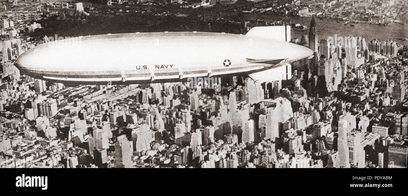 The United States navy's  helium-filled rigid airship USS Akron (ZRS-4) seen here flying over New York City.  The Akron crashed into the sea off the coast of New Jersey in 1933 during a thunderstorm, killing 73 of the 76 crewmen and passengers on board.  From These Tremendous Years, published 1938. Stock Photo