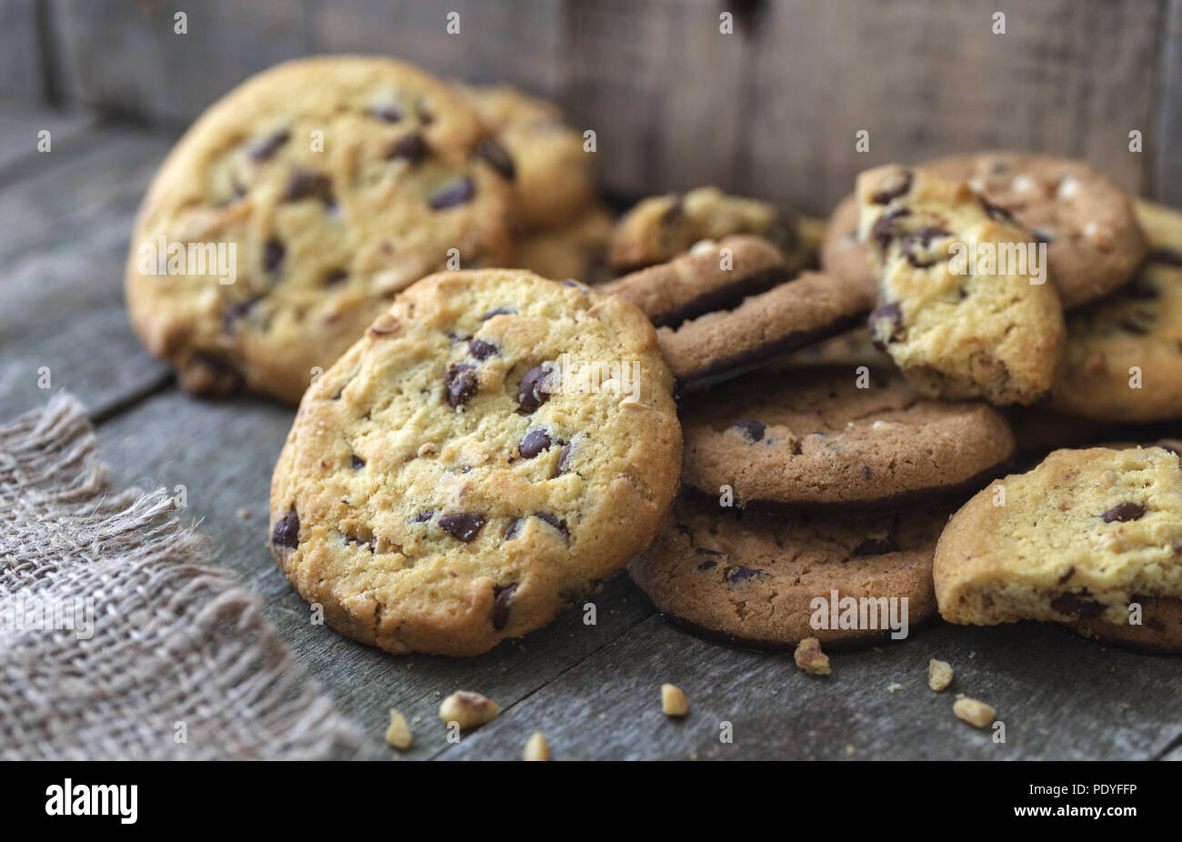 Rounded chocolate cookies on natural old desk. Stock Photo