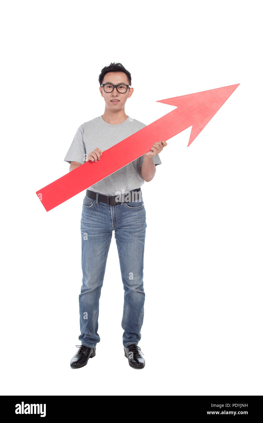 young man raises big red arrow isolated on white Stock Photo - Alamy