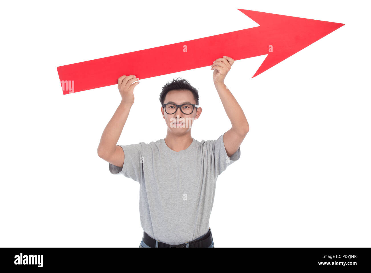 young man raises big red arrow isolated on white Stock Photo - Alamy