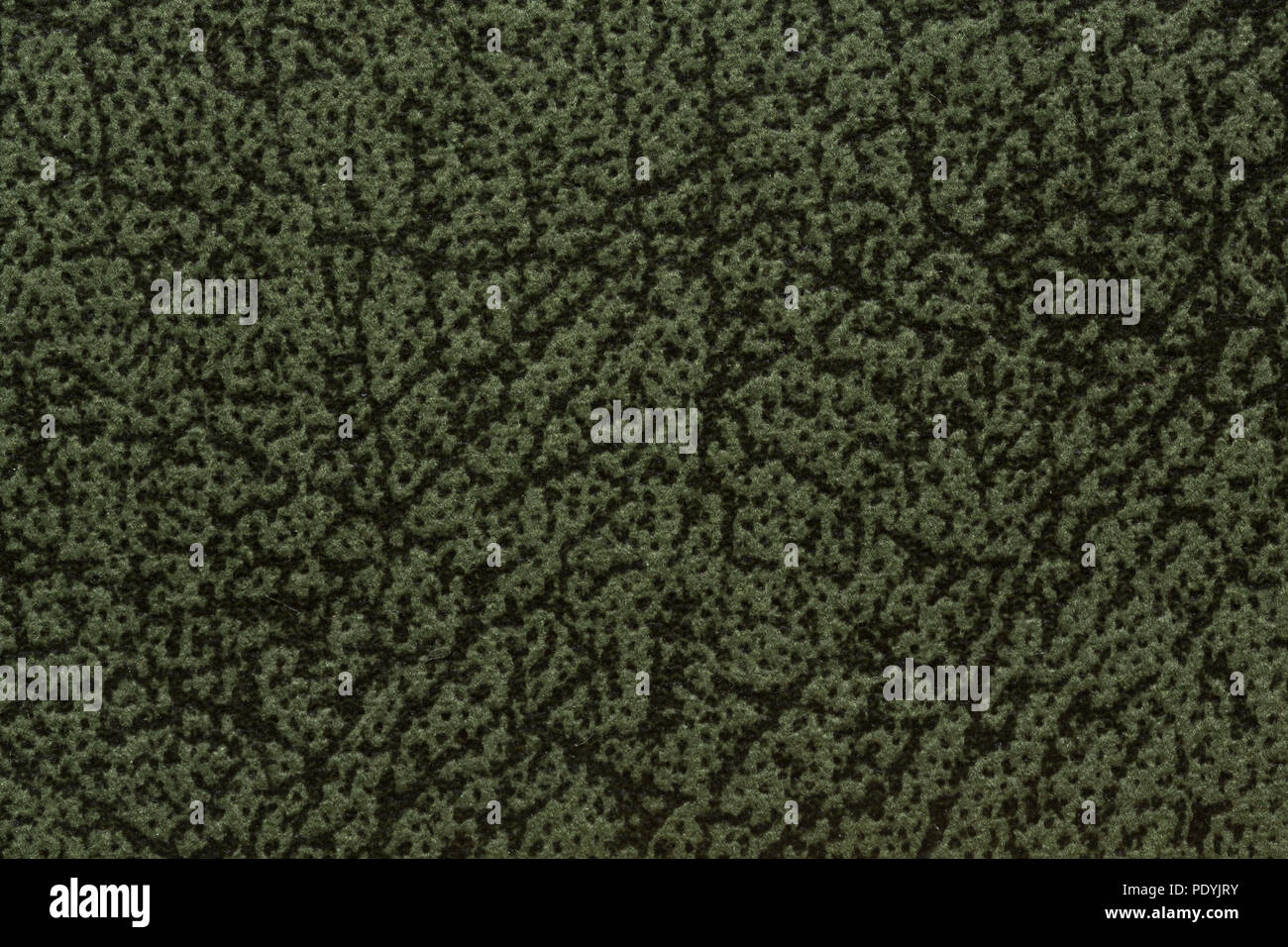 Uncommon textile background in saturated deep green hue. Stock Photo