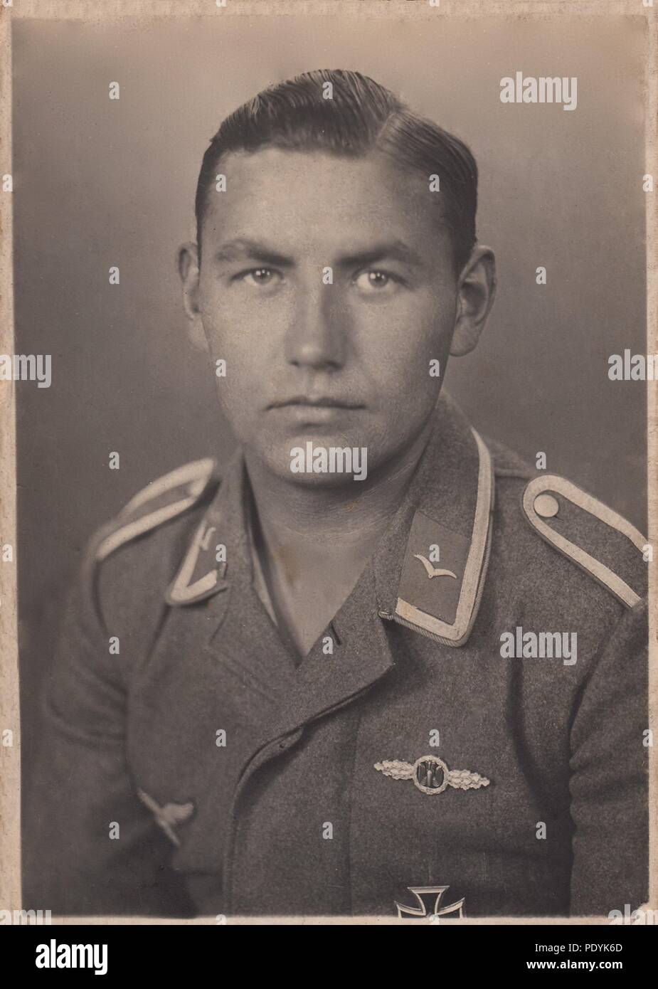 Image from the photo album of Feldwebel Willi Hoffmann of 5. Staffel, Kampfgeschwader 30: A very nice studio portrait of Unteroffizier Willi Hoffmann of 5./KG 30, taken in spring 1941. Hoffmann is wearing the Bomber Clasp in Silver (for completion of 60 missions) and Iron Cross 1st Class. Will Hoffmann and his entire crew failed to return from a mission in the Mediterranean on 23rd January 1943. Stock Photo