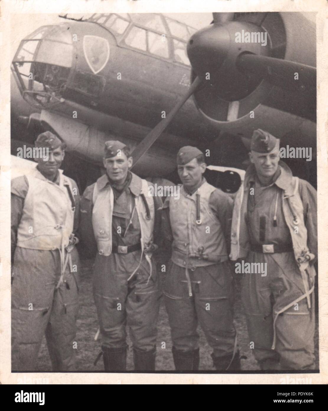 Image from the photo album of Feldwebel Willi Hoffmann of 5. Staffel, Kampfgeschwader 30: Willi Erkens and his crew from 5./KG 30 pose beside their Junkers Ju 88A-1 bomber in April 1940. Left to right: Gefreiter Wilhelm Hoffmann (Air Gunner), Unteroffizier Wilhelm Erkens (Pilot), Unteroffizier Richard Müller (Observer), Unteroffizier Otto Beinmüller (Radio Operator). The entire crew failed to return from a mission in the Mediterranean on 23rd January 1943. Stock Photo