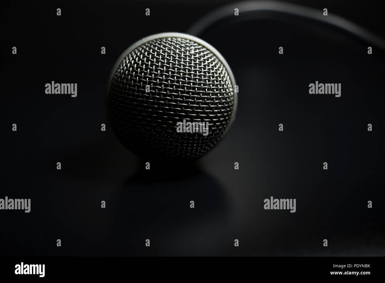 Microphone and cord detailed close up. Macro texture of a musicians ...