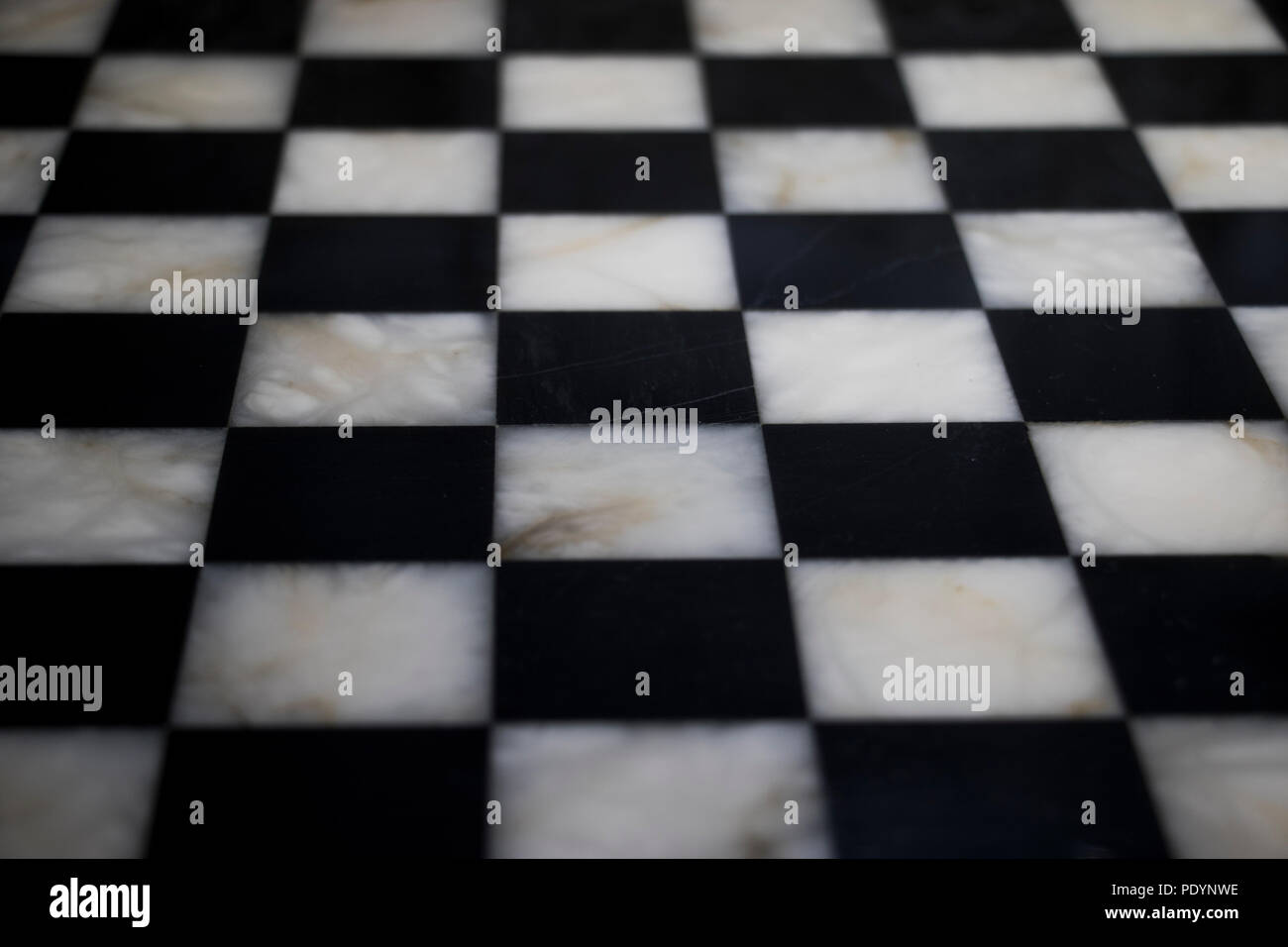 Chess board checkered patterned surface in marble. Stock Photo