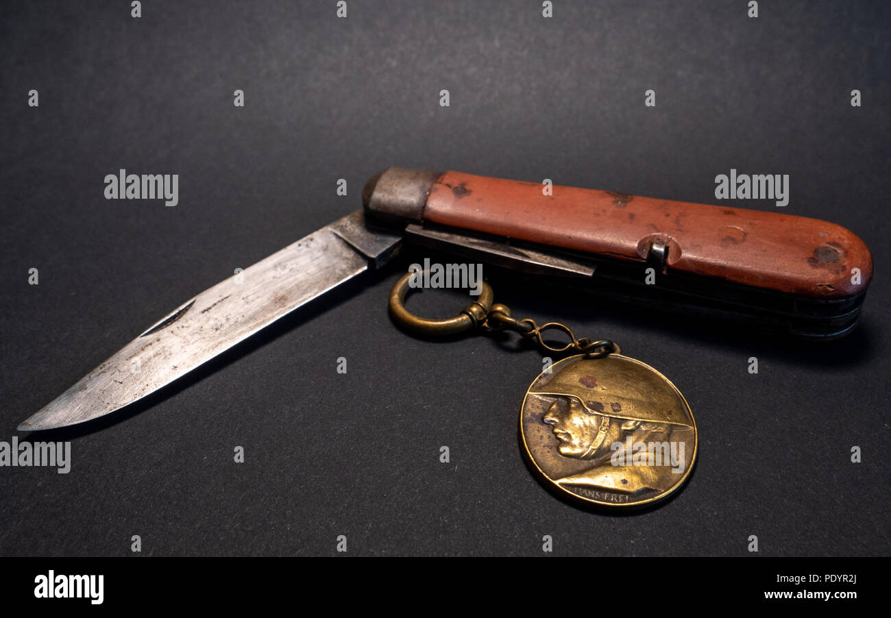 vintage antique swiss military pocket knife with pocket clock and soldier  emplem white background world war 2 leather surface Stock Photo - Alamy