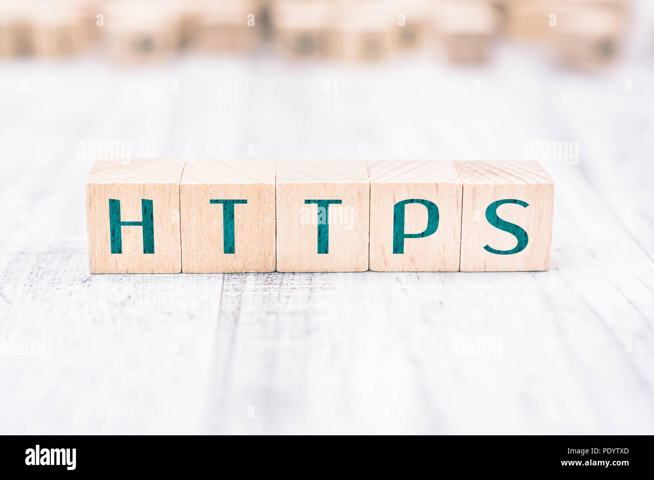 The Word HTTPS Formed By Wooden Blocks On A White Table Stock Photo