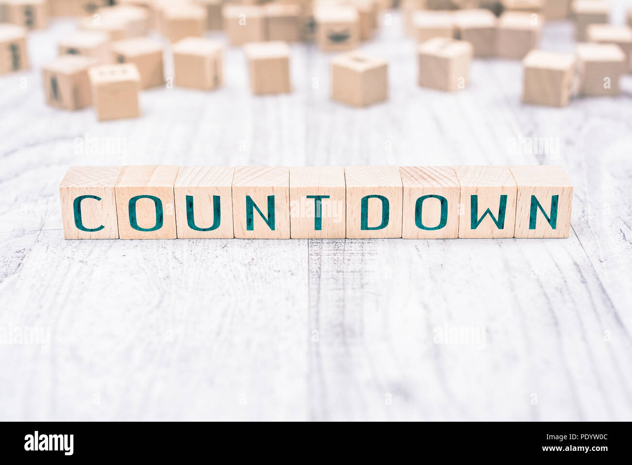 The Word Countdown Formed By Wooden Blocks On A White Table, Reminder