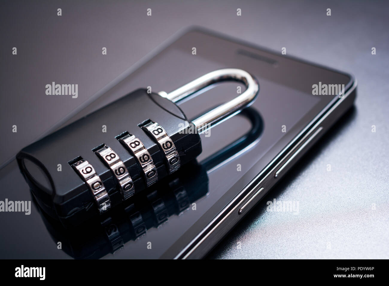 Combination Lock Lying On A Mobile Phone App Security Concept Stock