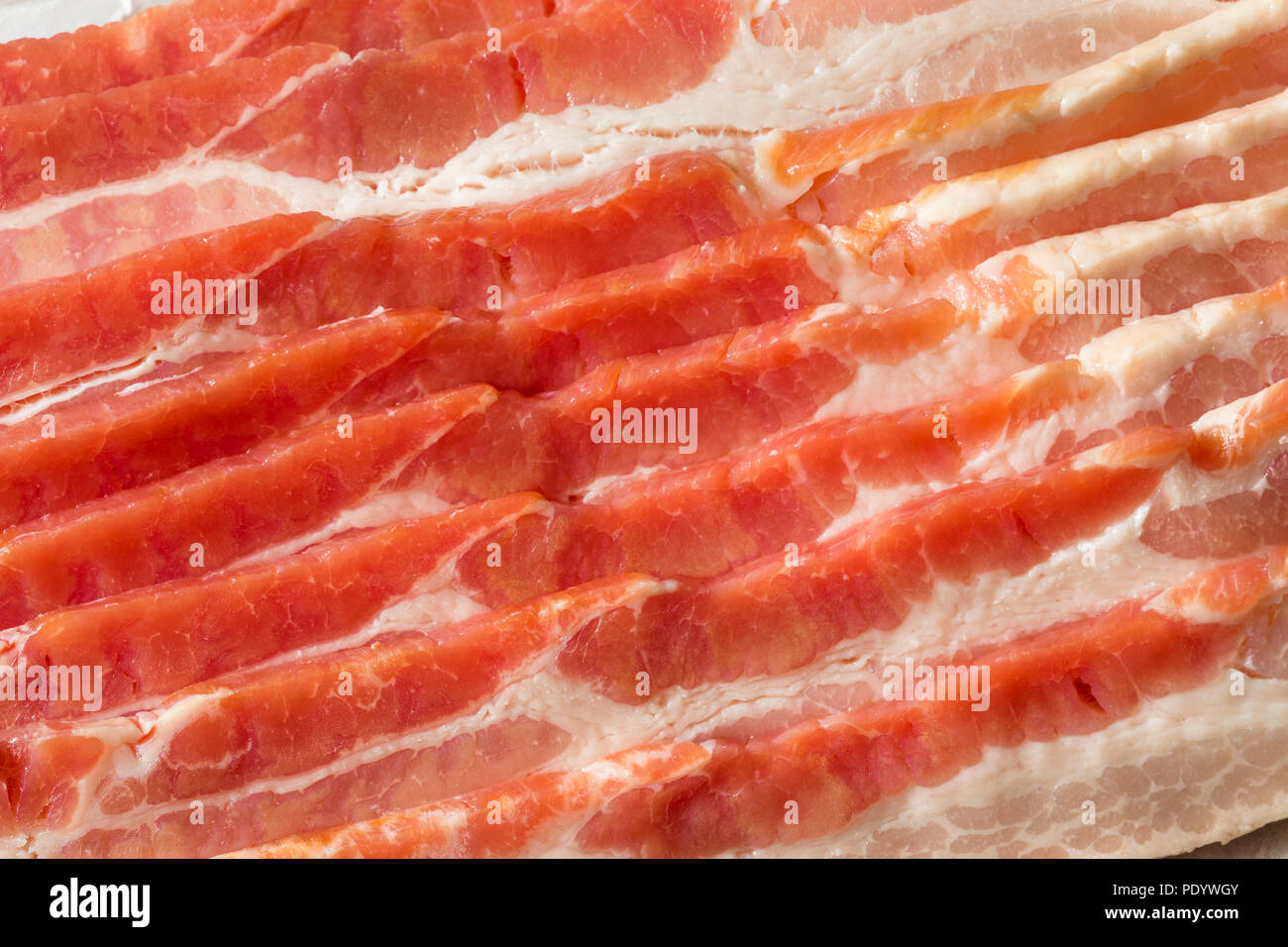 Raw Grass fed Bacon Strips Ready to Cook Stock Photo