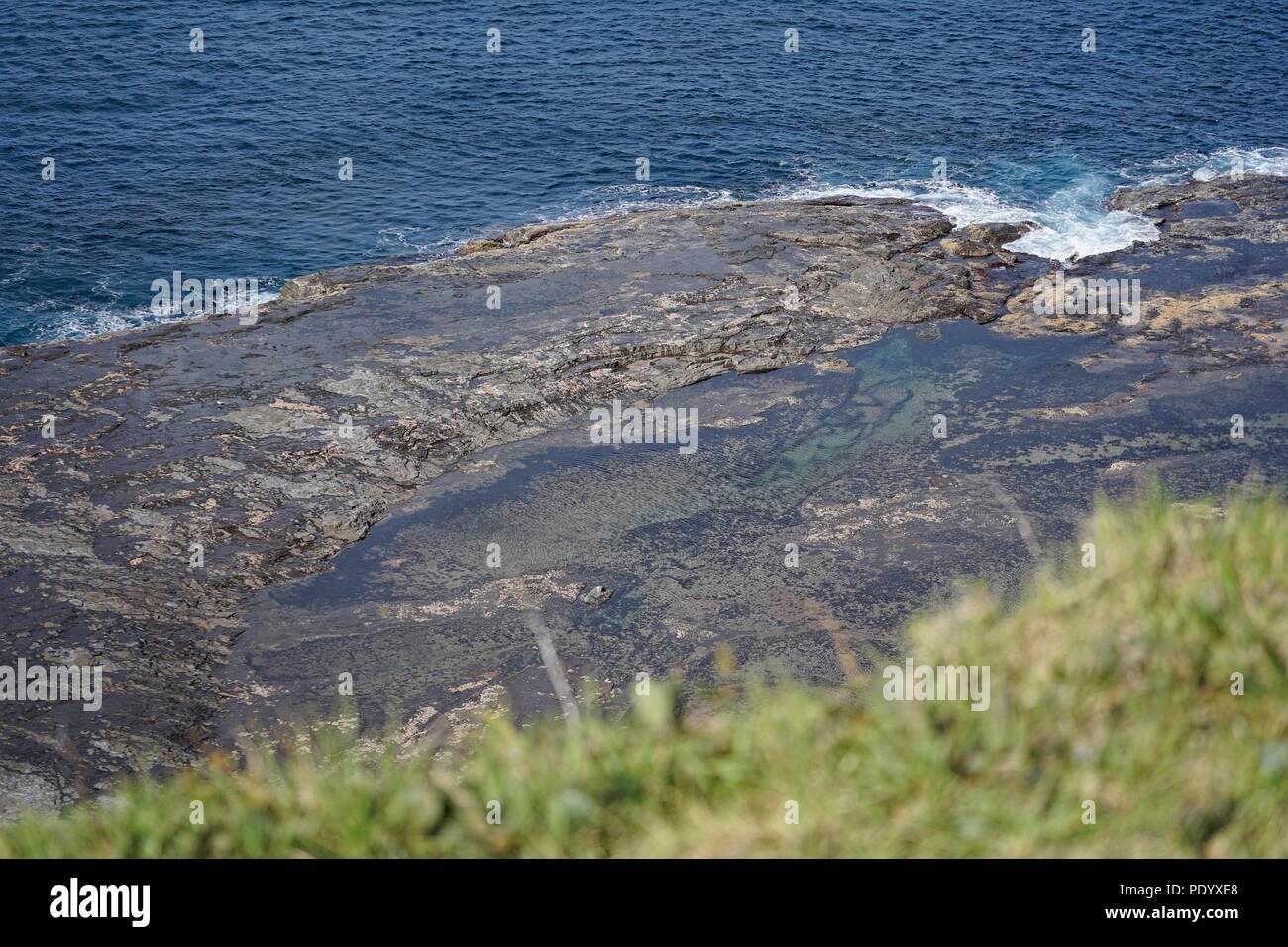 Rock shelf on the coast of Australia. View from a cliff. Stock Photo