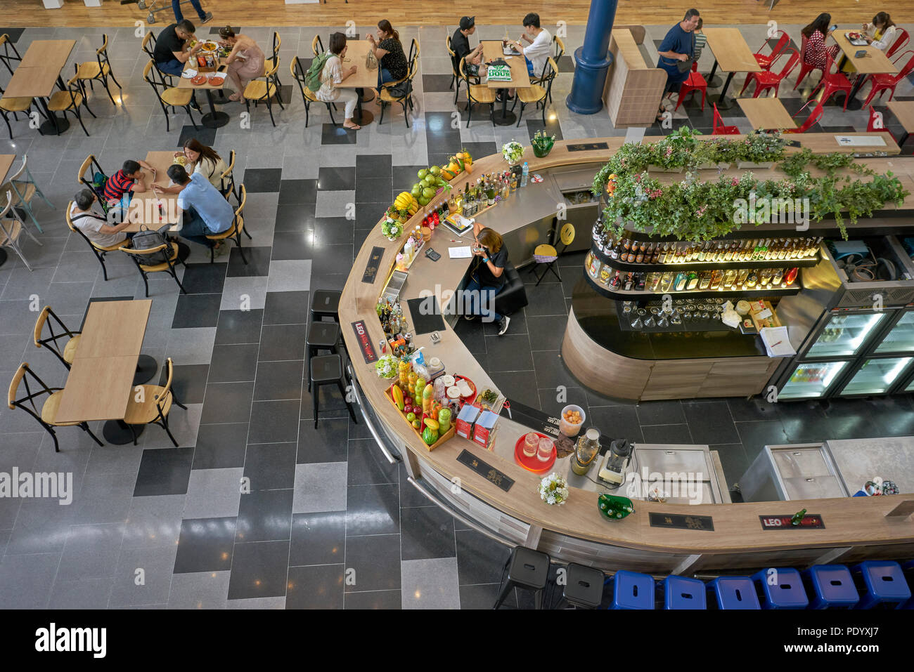 Overhead view of the restaurant dining area in a Thailand shopping mall. Diners from above. Southeast Asia. Stock Photo