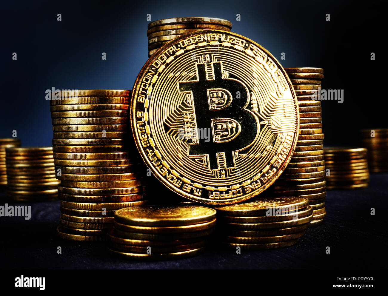 Bitcoin BTC and stacks of coins. Crypto stock exchange concept. Stock Photo