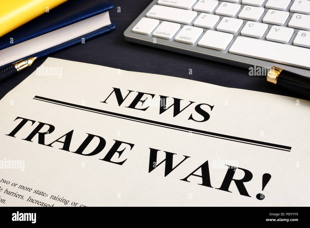 Newspaper with title Trade war on a desk. Stock Photo