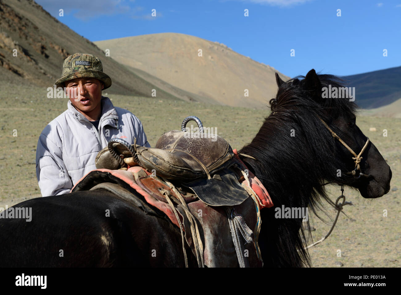 A boy and his horse on the steppe of Mongolia Stock Photo - Alamy