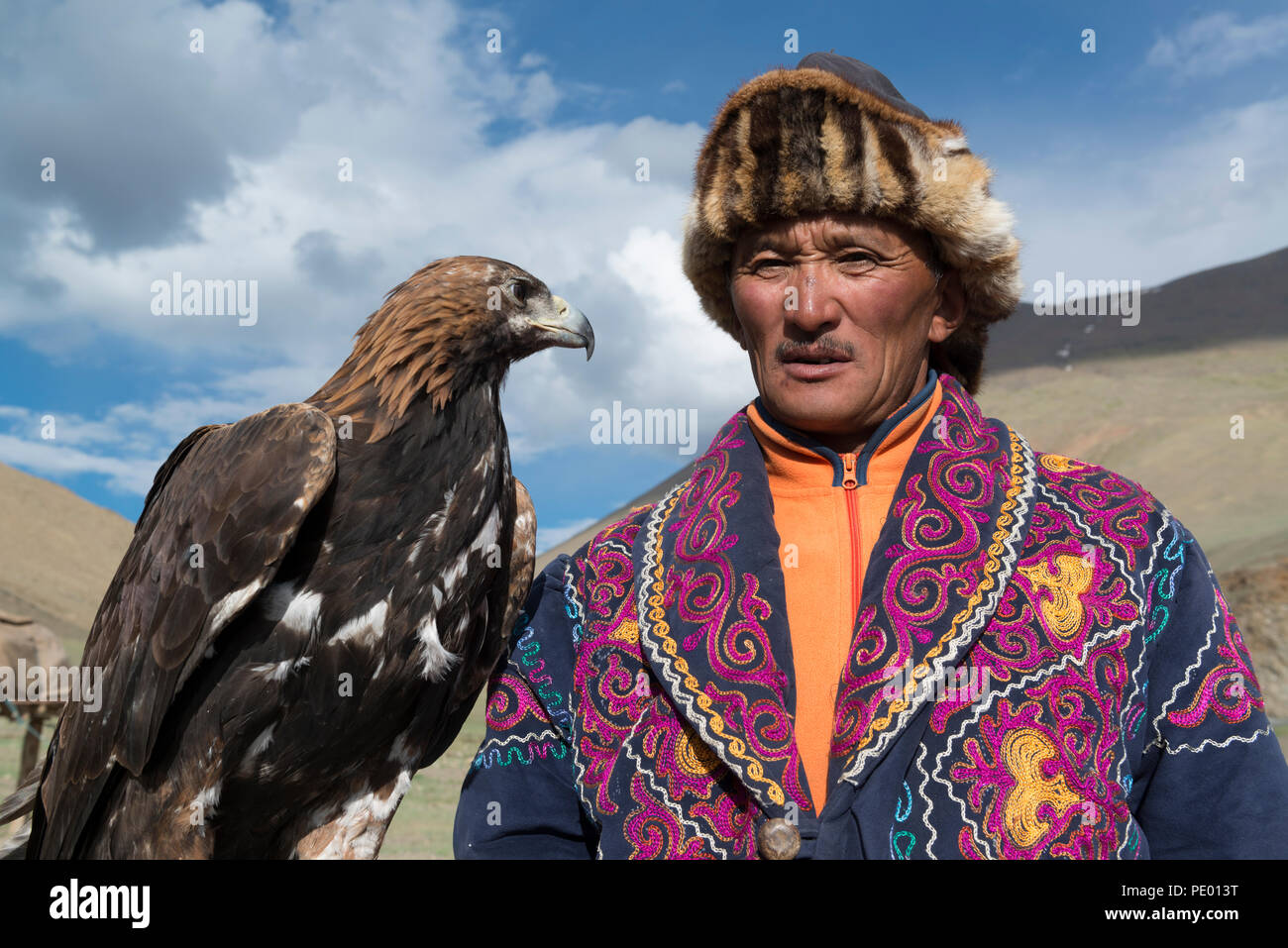 A Kazakh Eagle Hunter With His Golden Eagle In Bayan Olgii