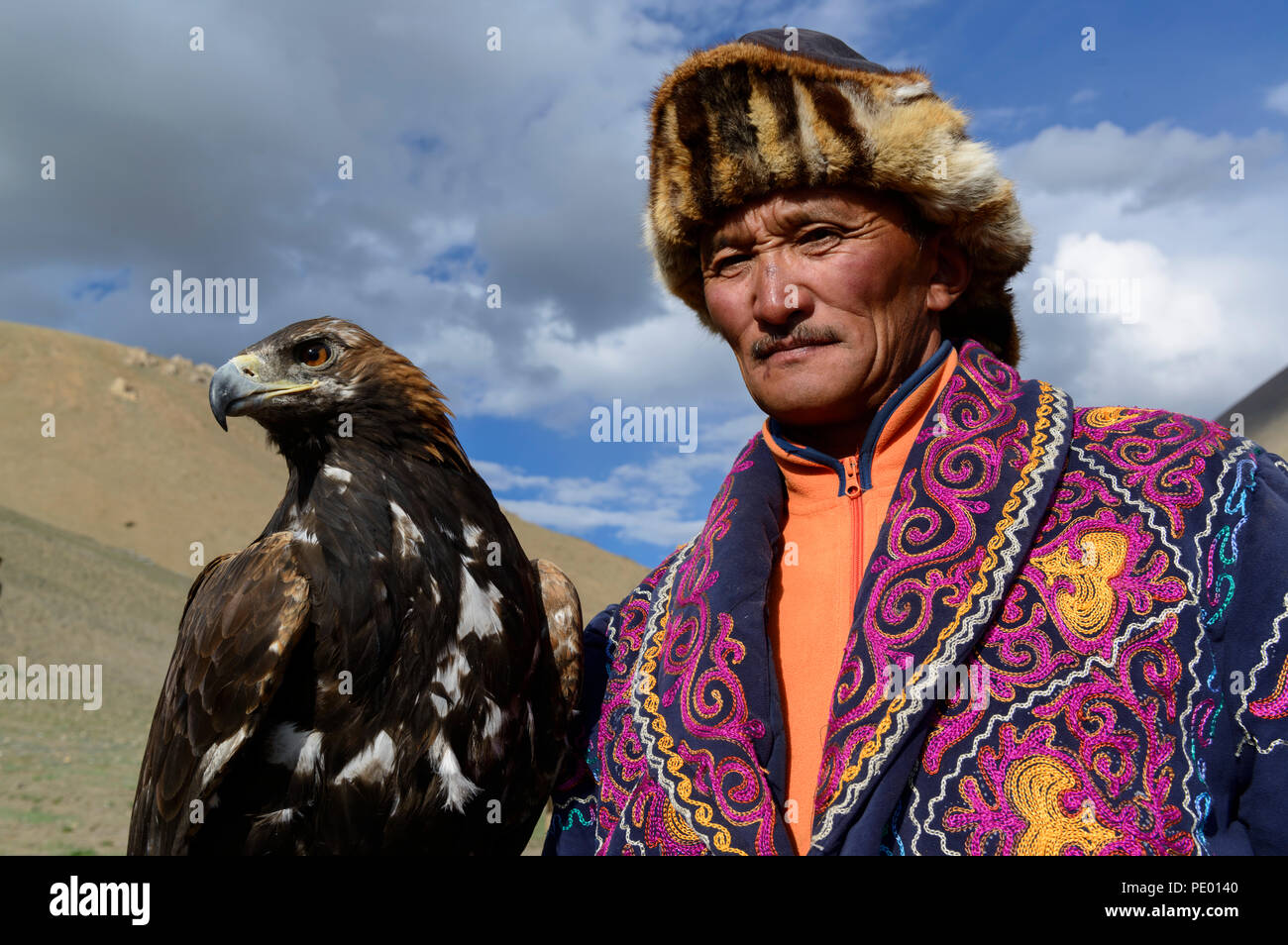 A Kazakh Eagle Hunter With His Golden Eagle In Bayan Olgii
