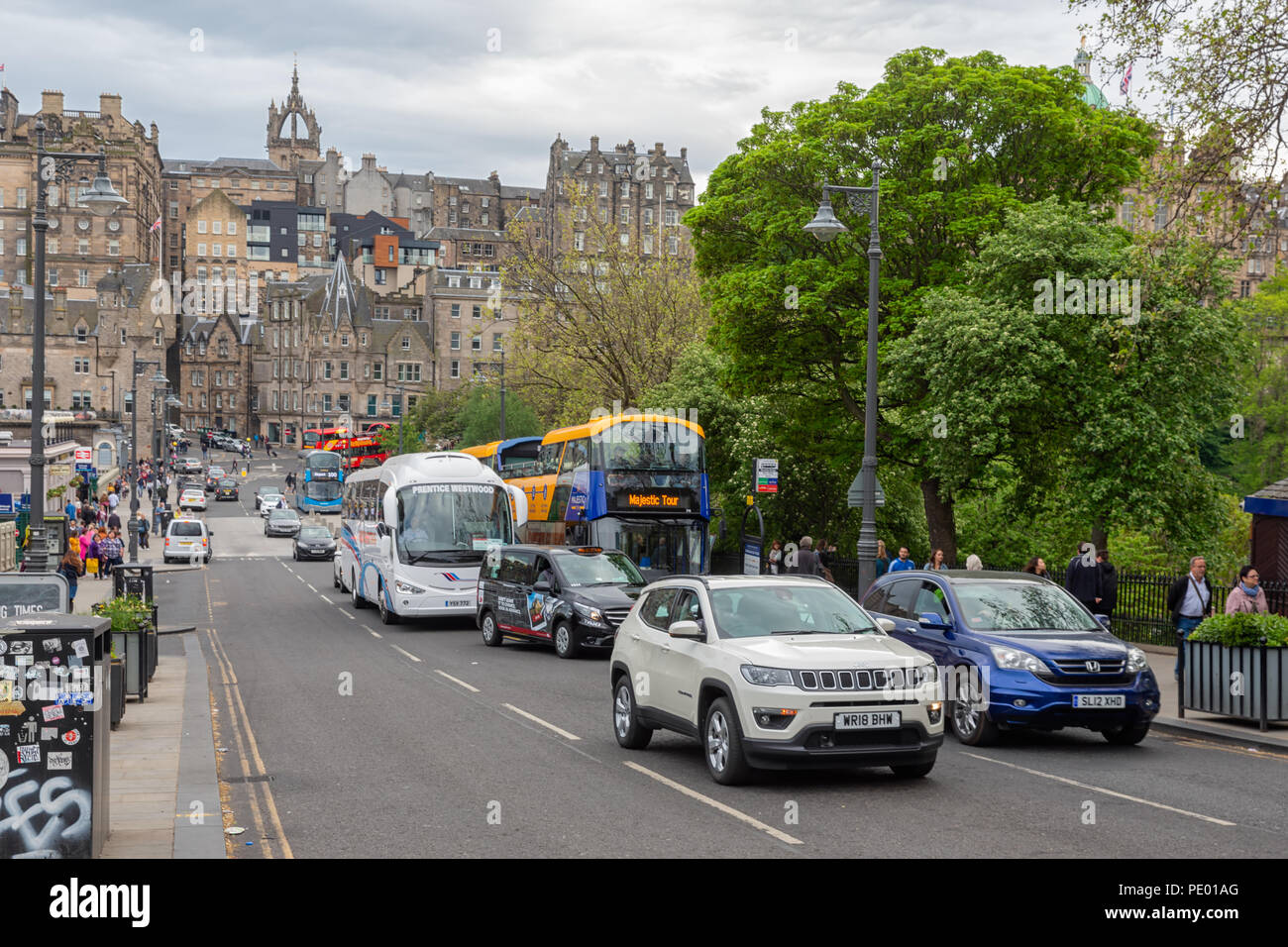 Street scene Edinburgh near Waverley Station with cars and pedestrians Stock Photo