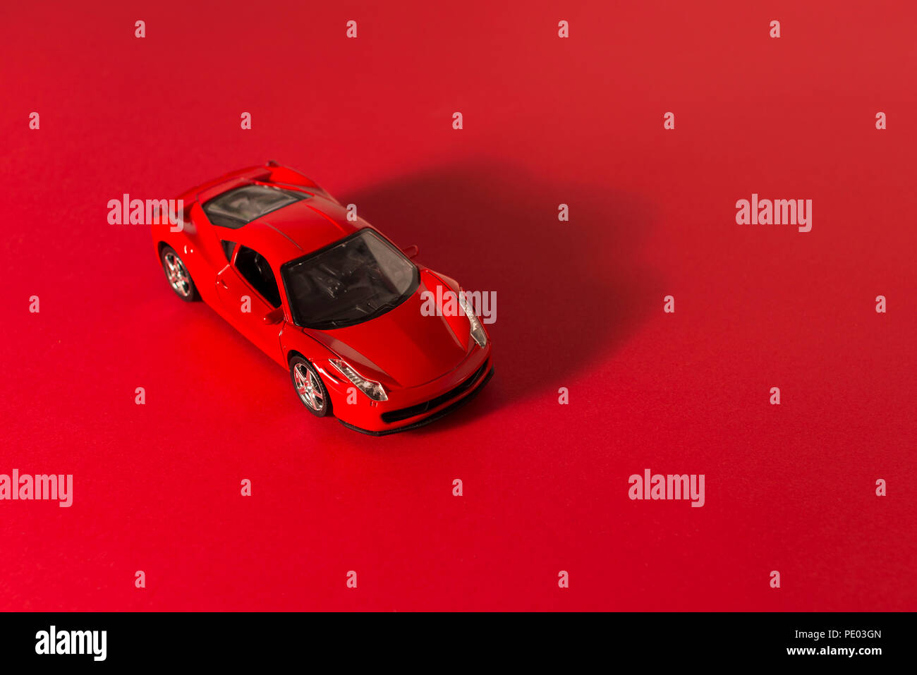 Izmir, Turkey February10, 2018 Red toy sports car on a red