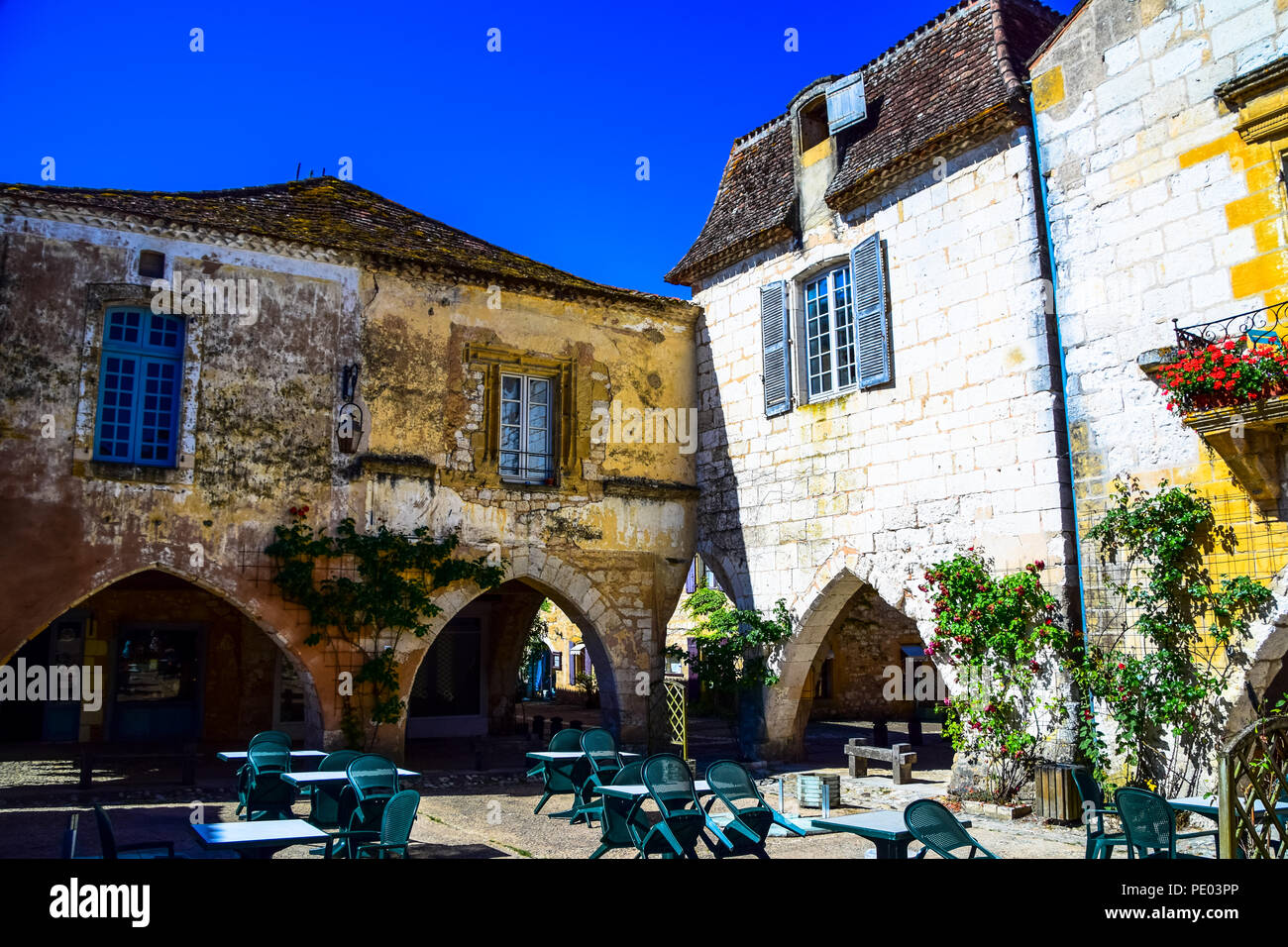 Central square in the medieval bastide village of Monpazier in the Dordogne region of France Stock Photo