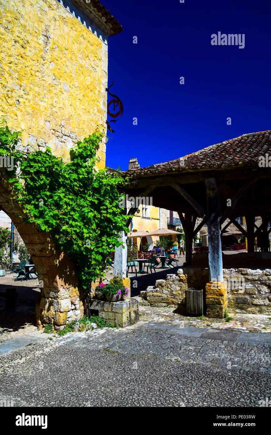 Central square in the medieval bastide village of Monpazier in the Dordogne region of France Stock Photo