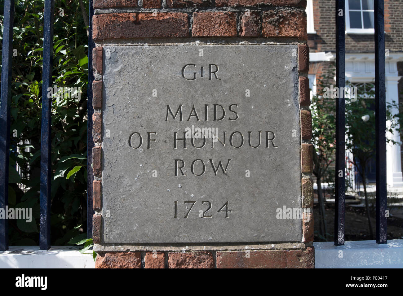 plaque marking maids of honour row, a group of 1720s houses  facing richmond green, surrey, england, and built by order of king george II Stock Photo