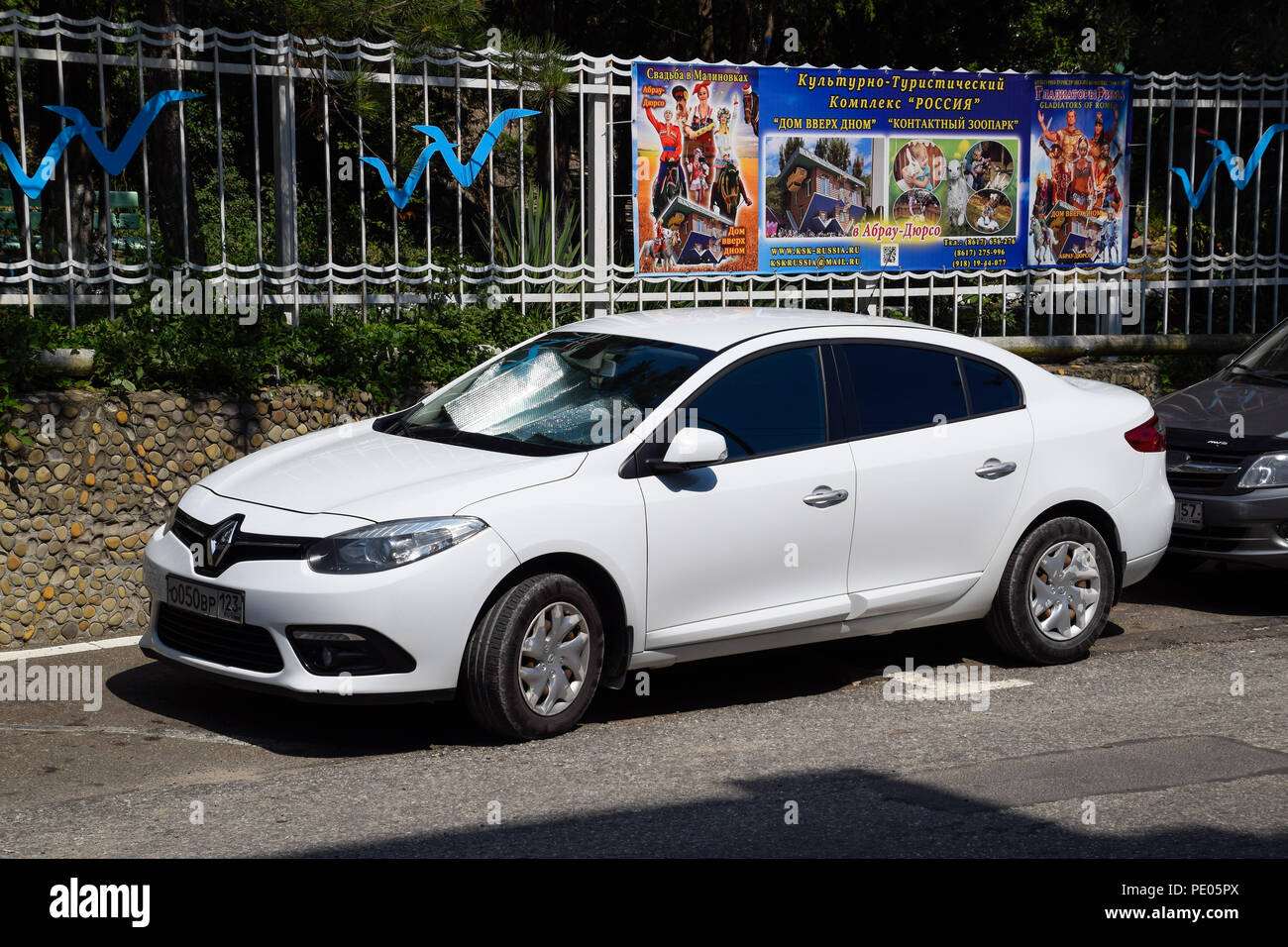 Novorossiysk, Russia - August 06, 2018: Parked car on the roadside of the city road Renault Fluence Stock Photo