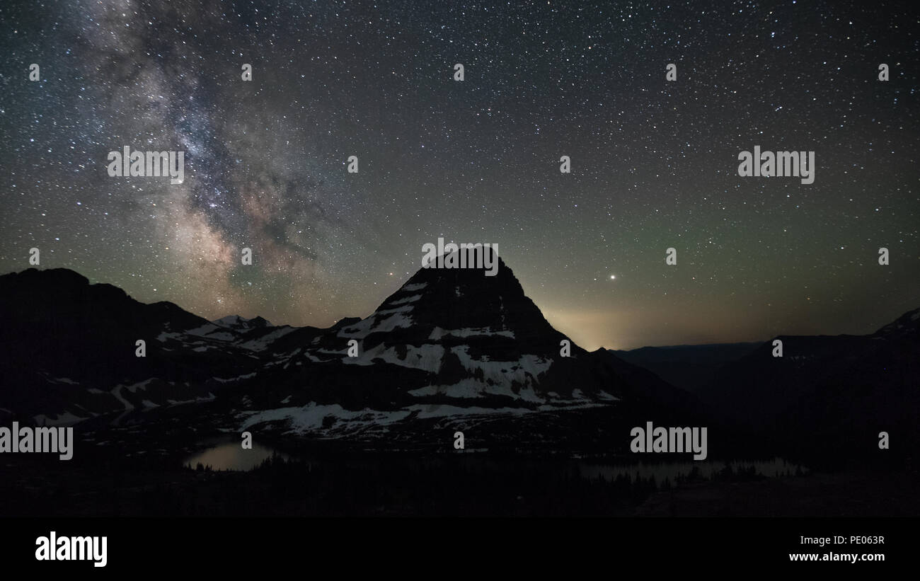 This is the picture of Raynolds Mountain at Hidden Lake area ast Glacier National Park, Wyoming, at night with mikway. Stock Photo