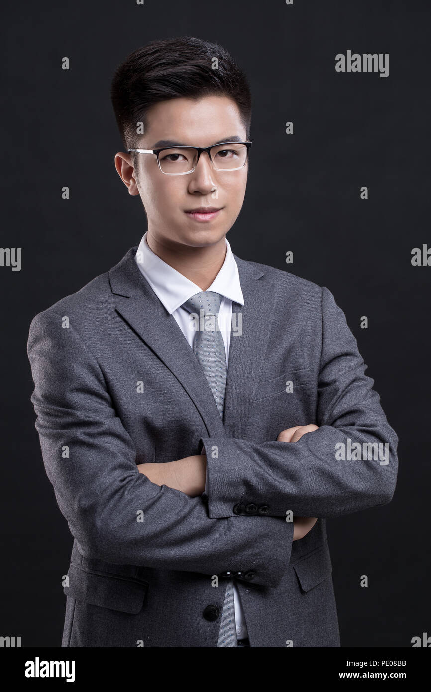 Businessman wearing suit and glasses Stock Photo Alamy