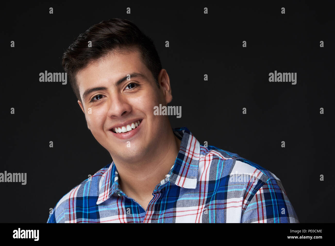 Happy young smiling latin man portrait in casual outfit Stock Photo
