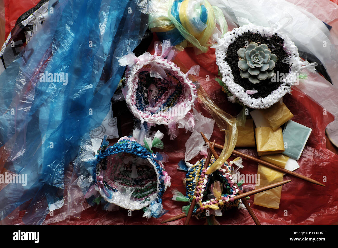 Cut nylon bag into yarn and knit to basket, good idea to recycle nylon