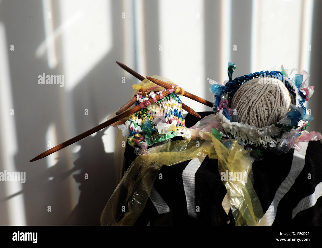 Cut nylon bag into yarn and knit to basket, good idea to recycle nylon