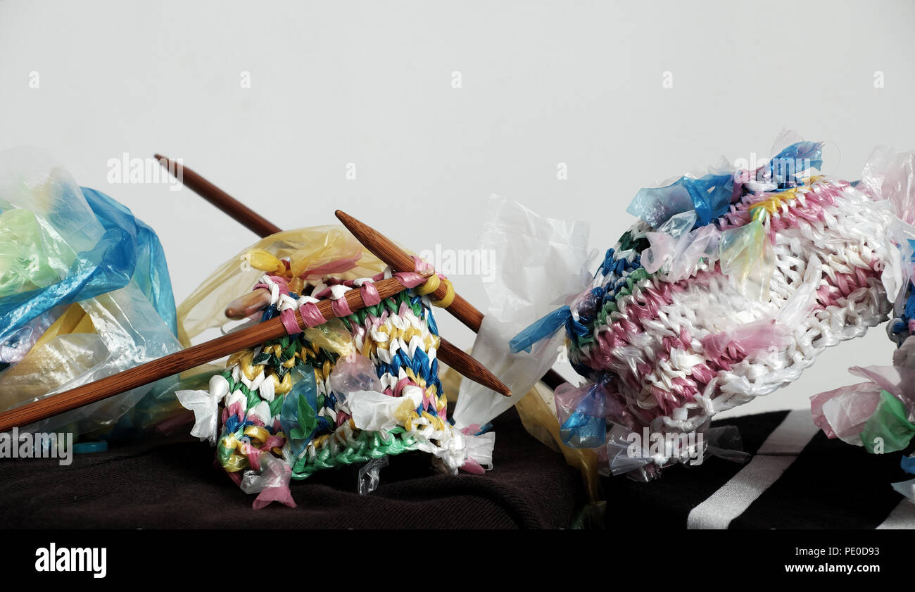 Cut nylon bag into yarn and knit to basket, good idea to recycle nylon