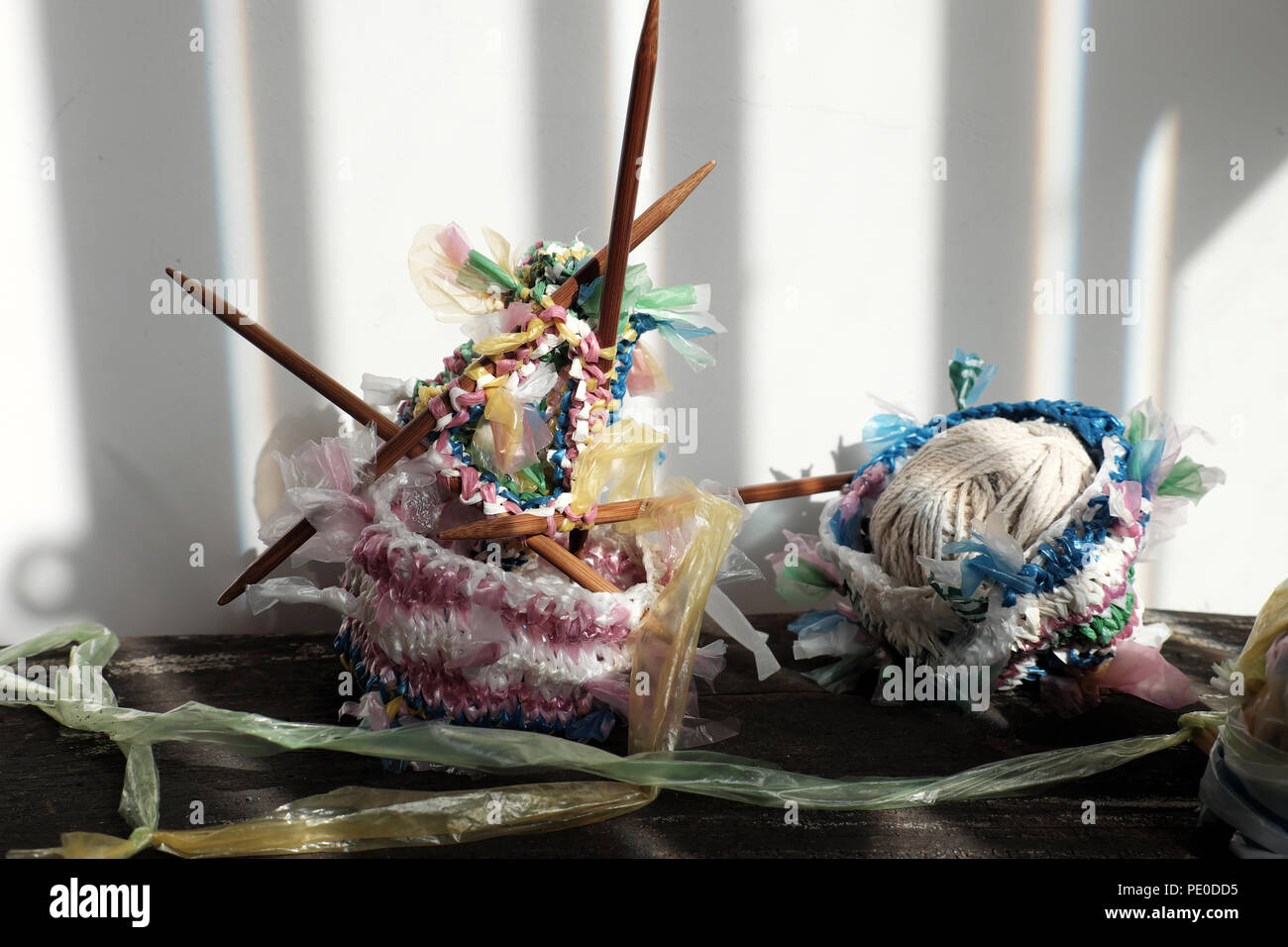 Cut nylon bag into yarn and knit to basket, good idea to recycle nylon