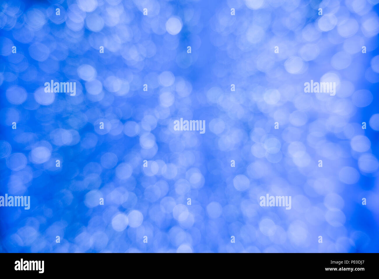 Abstract blue bokeh circles for Christmas background. Royalty high-quality  free stock photo of Christmas light overlay background. Holiday glowing bac  Stock Photo - Alamy